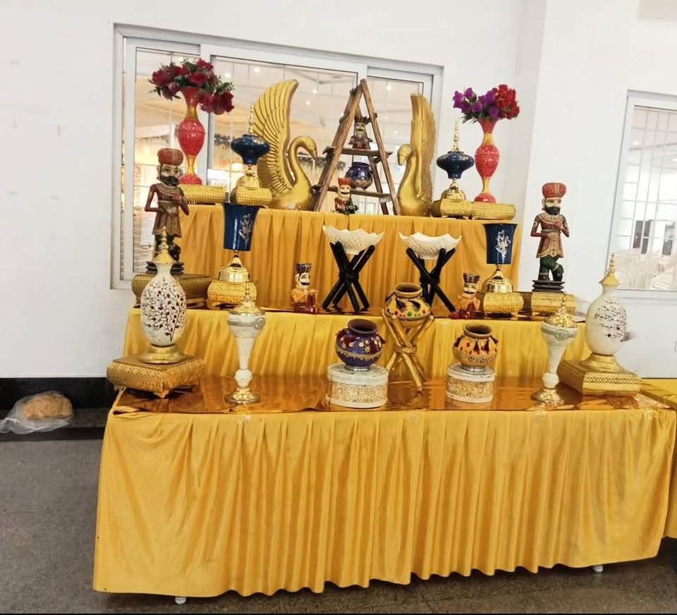 Golden draped stall with swan and Rajasthani decor