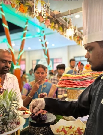 Chef serving at a live food station